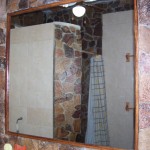 Nice, large mirror. There is additional lighting directly above the mirror.