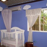 A very pleasant room. That's a mosquito net you see there. Feel free to use it anywhere in the house you like.